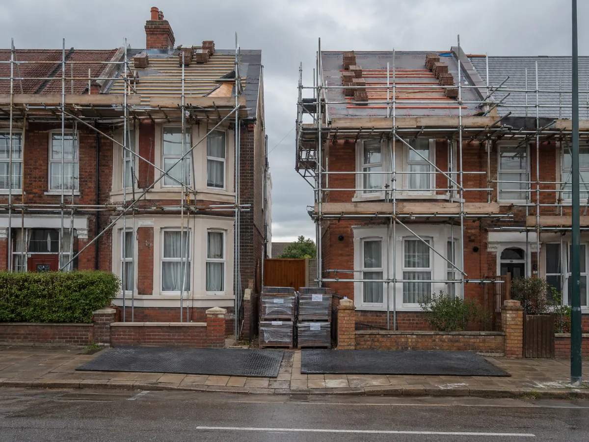 Two scaffolded Victorian properties undergoing simultaneous re-roofs in Ipswich